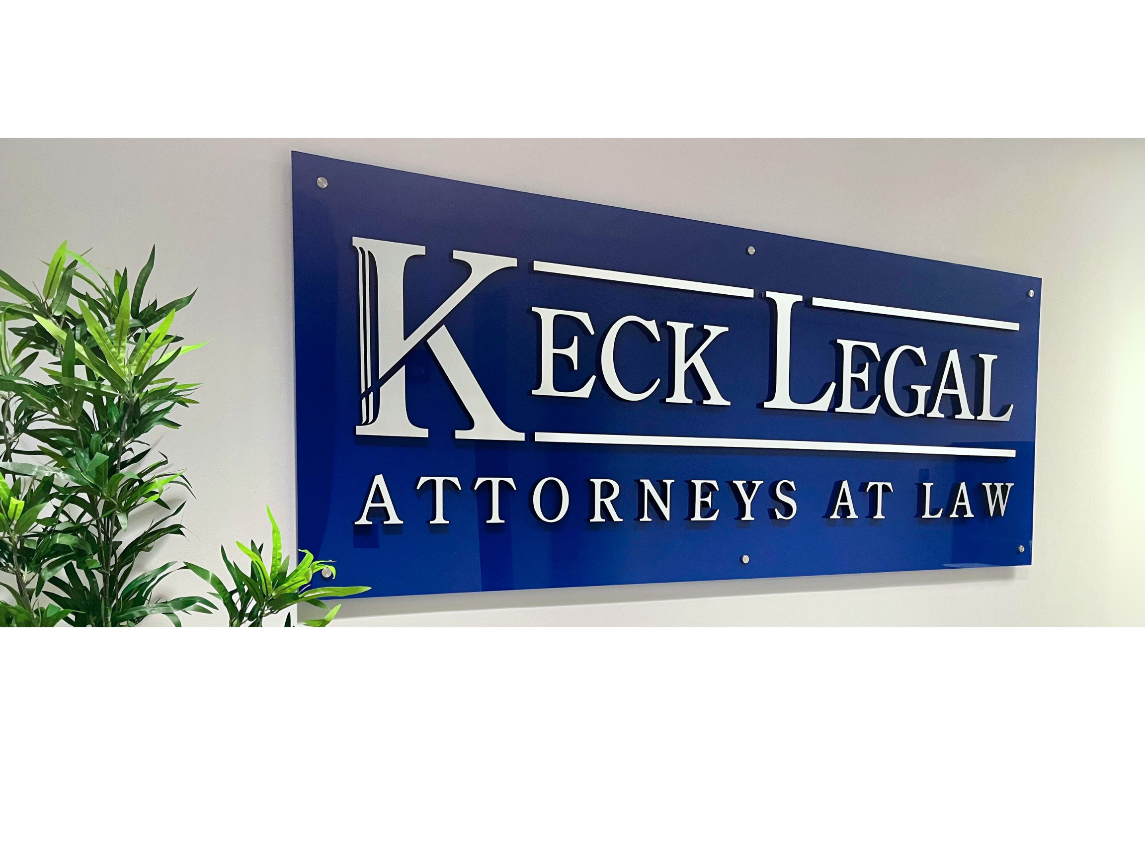 Keck Legal logo board at the office.